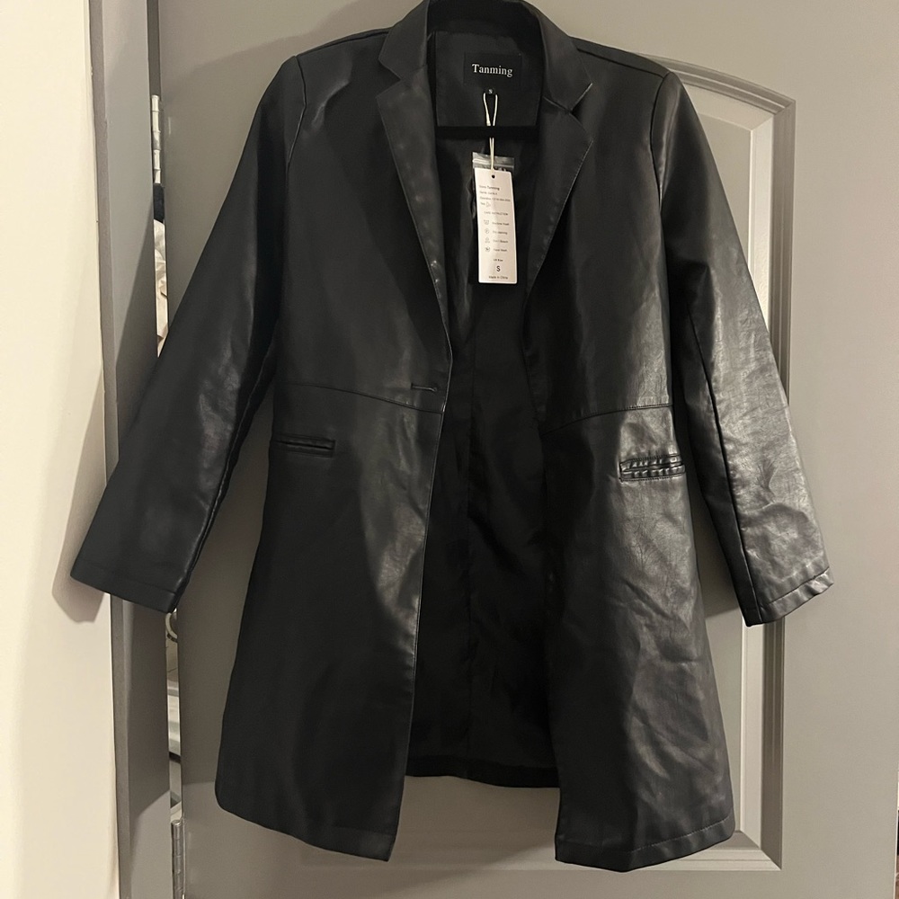 Black “leather” jacket. Not real leather but made of nice heavy material
